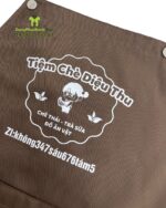 Tạp dề dành cho nhân viên quán trà sữa thiết kế dây bấm nút tiện lợi, in logo theo yêu cầu