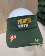 Nón đồng phục nhân viên phục vụ quầy thiết kế màu xanh rêu đẹp mắt. in logo PROPER CORN