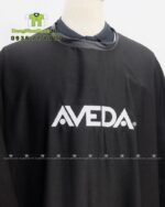 Áo choàng cắt tóc thiết kế nút gài linh hoạt, in logo Aveda.
