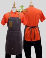 Bộ đồng phục quán trà sữa thiết kế áo thun đồng phục màu cam tạo sự chú ý, theo phong cách năng động và hiện đại.