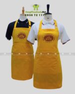 Tạp dề đồng phục tiệm bánh mì thiết kế màu vàng bắt mắt, in logo Vietnamese Bread - Banh mi 247.