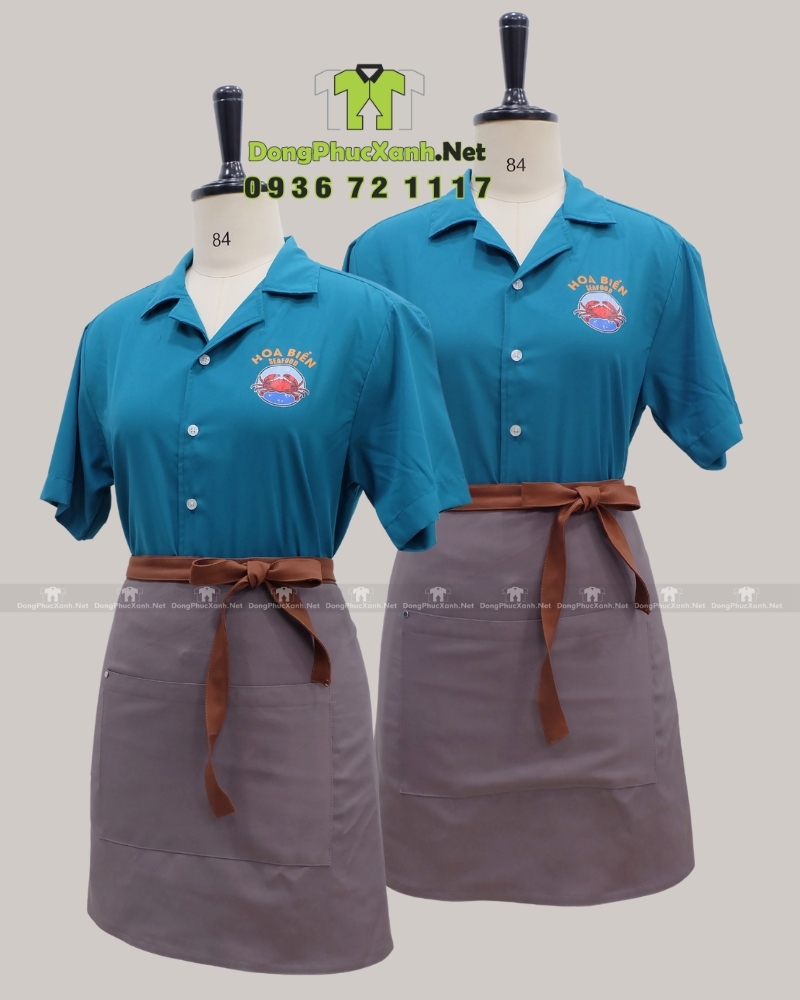 Áo sơ mi đồng phục cho nhân viên in logo Hoa Biển.(5) Áo sơ mi đồng phục cho nhân viên phục vụ màu xanh biển bắt mắt, in logo Hoa Biển.