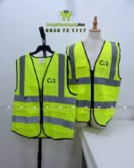 Áo gile phản quang vàng, in logo CIR, có túi hộp và khóa kéo tiện dụng