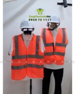 Áo gile phản quang màu cam nổi bật, có dải phản quang an toàn, in logo VACONS chuyên nghiệp