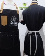 Tạp dề nhân viên Bếp Mẹ Bơ màu đen và kem có túi