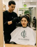 Áo choàng nhuộm tóc Incellderm vải dù màu trắng in logo