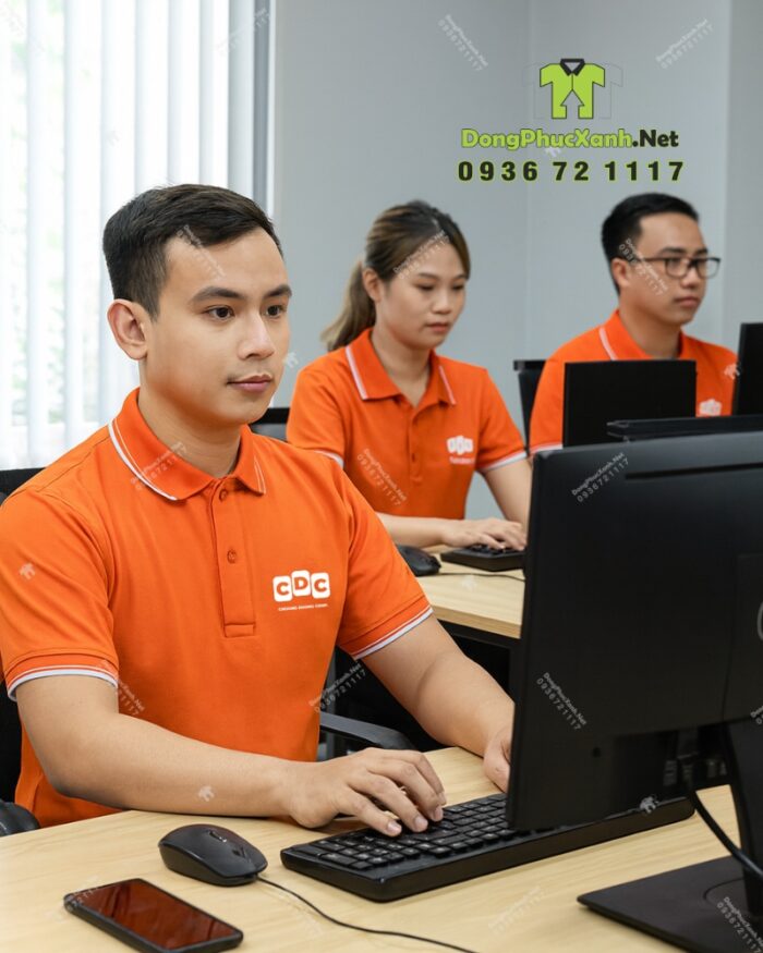 Áo thun đồng phục công ty CDC màu cam vải cá sấu 65/35.