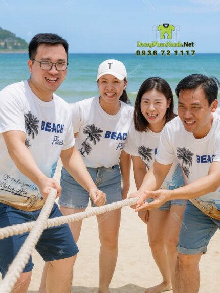 Đồng phục team building vải thun mè in logo Nguyễn Mẫn 2025 và hình ảnh bãi biển
