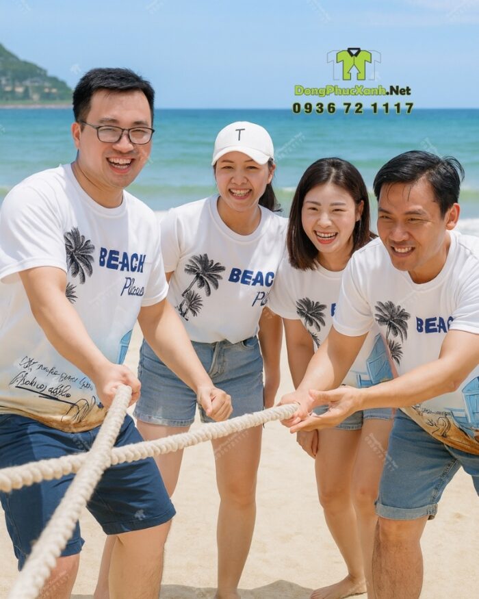 Đồng phục team building vải thun mè in logo Nguyễn Mẫn 2025 và hình ảnh bãi biển