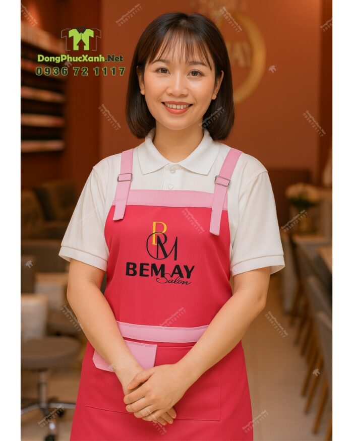 Tạp dề nail màu hồng vải kaki thun in logo Bemay Salon.