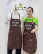 Tạp Dề Pha Chế In Logo Cam Coffee Trên Nền Vải Màu Nâu Vô Cùng Nổi Bật